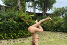 Lisa in bikini showing flexibility