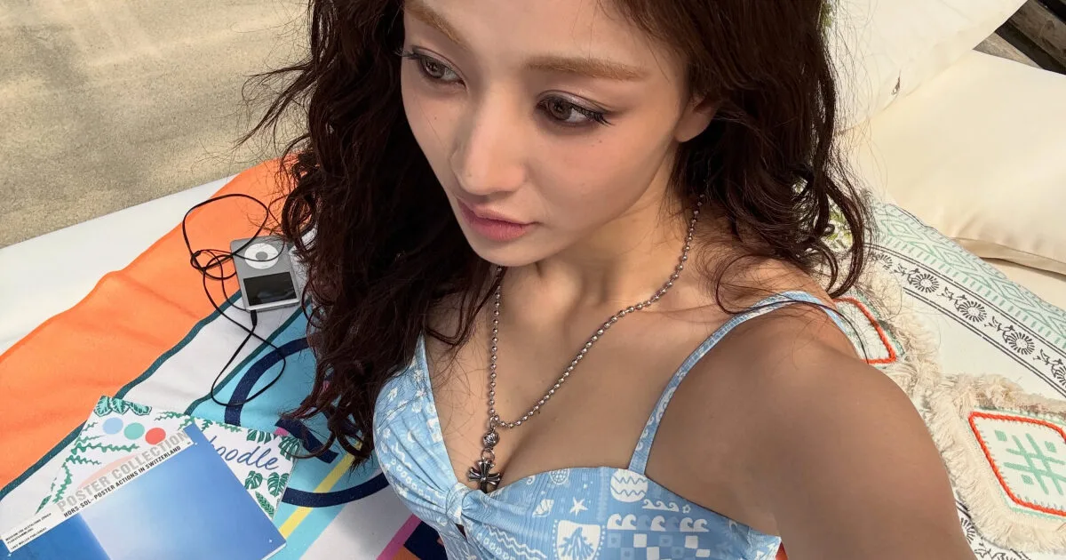 Jihyo posing at a swimming pool in stylish beachwear