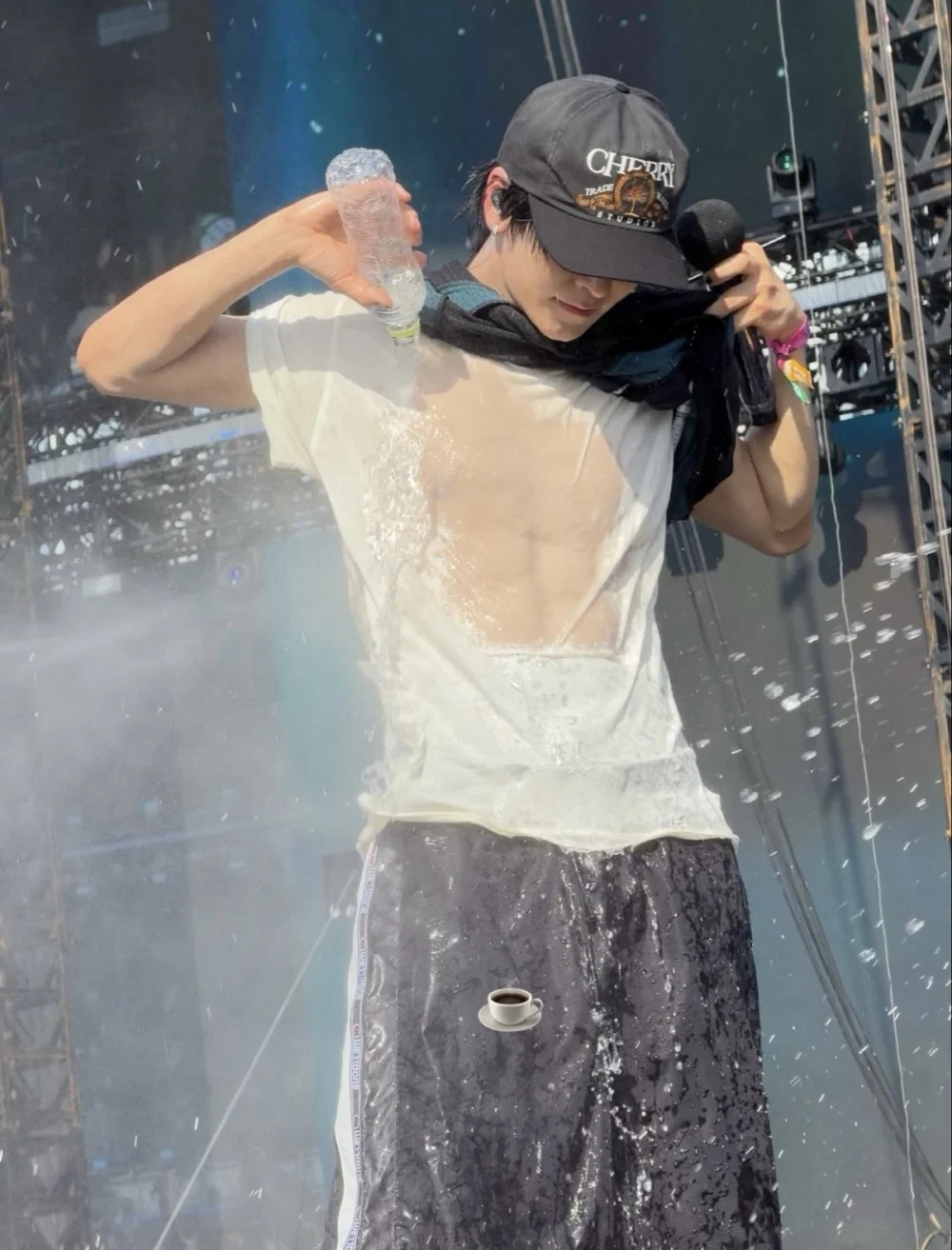 Xinlong showcasing his unique Coca-Cola-themed pants on stage