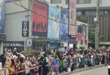 Fans gather near HYBE headquarters for RM and V’s discharge