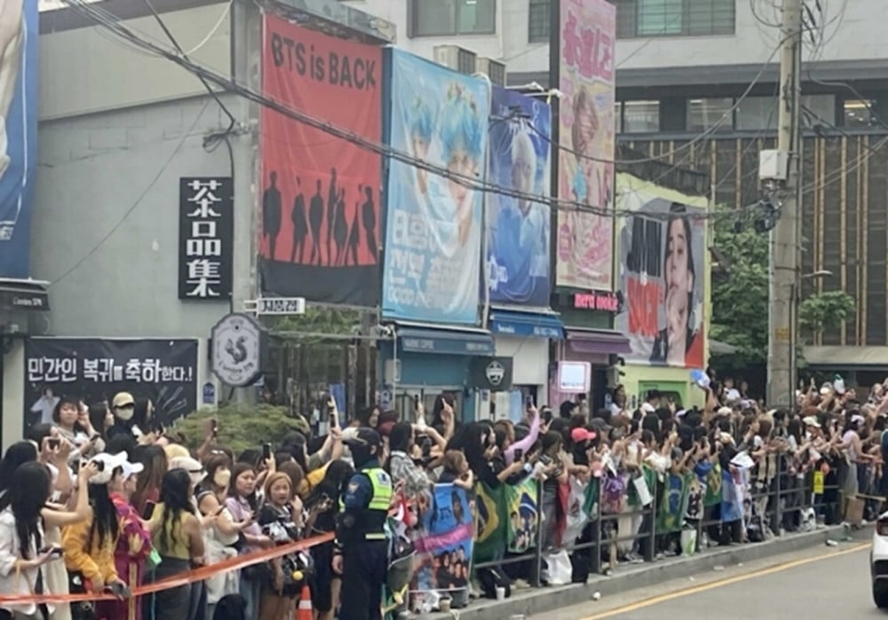 BTS Members RM and V Released, Thousands of Fans Assemble at HYBE Headquarters 1 Fans gather near HYBE headquarters for RM and V’s discharge